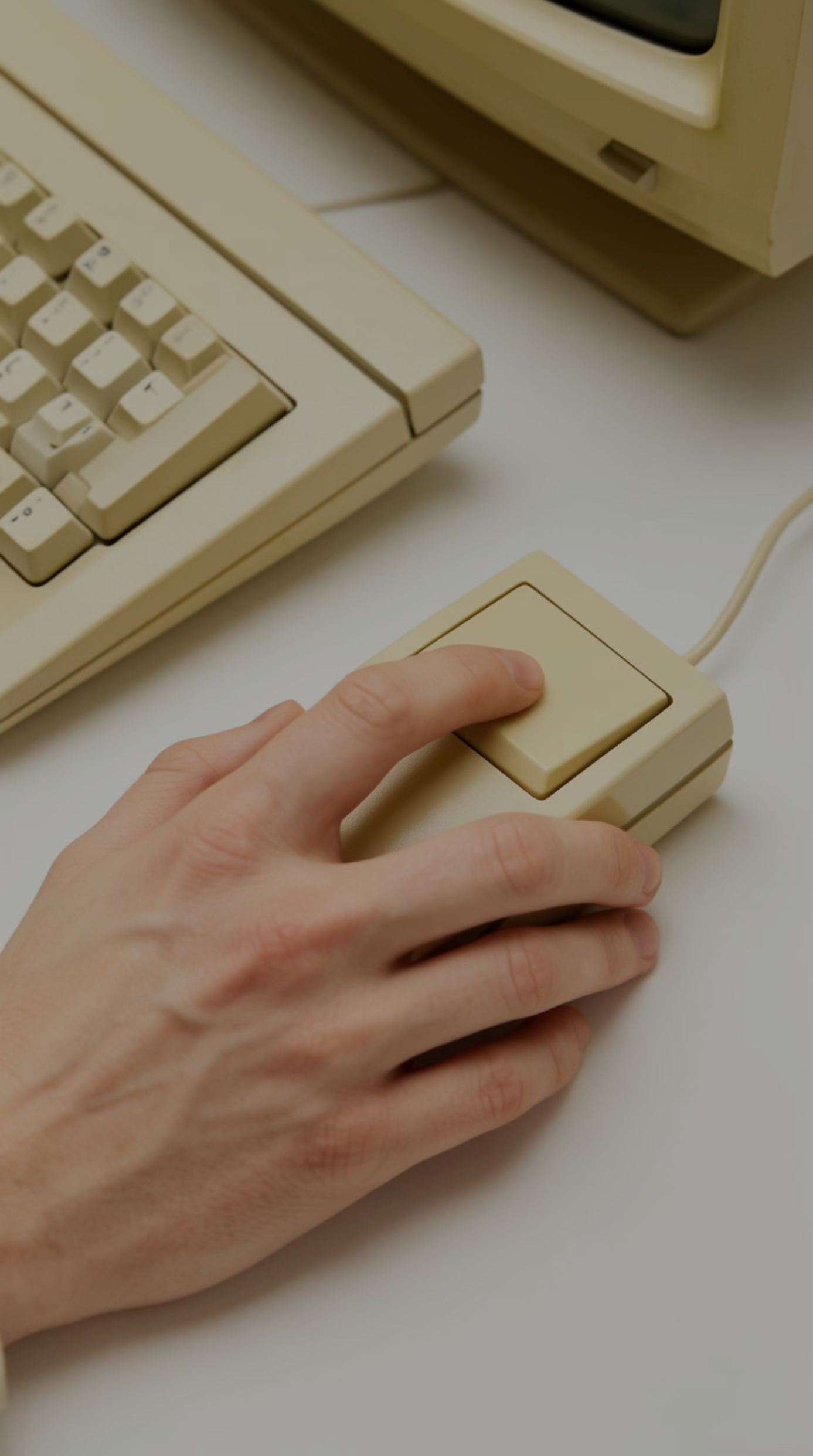 A hand operating a precise, early computer interface.